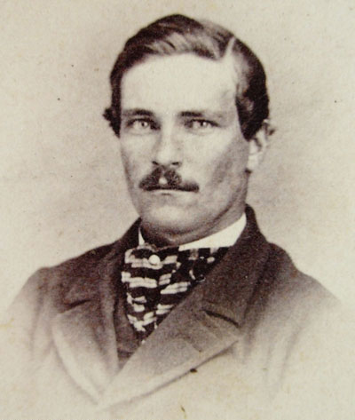 Neck scarf wearing mustached gentleman of the 1860s-1870s.