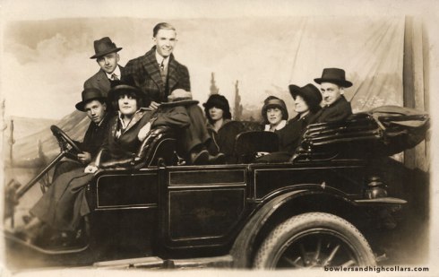 Studio photo of group in a car. RPPC. Private Collection.