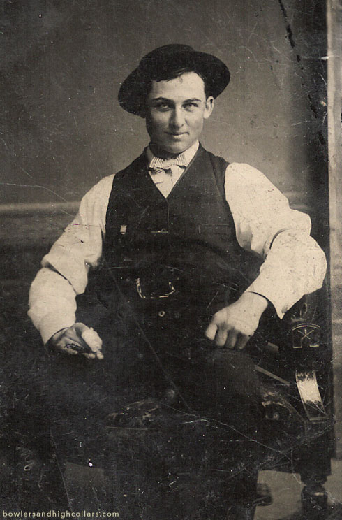 Smiling impishly with a bandaged finger. Tintype. Private Collection.