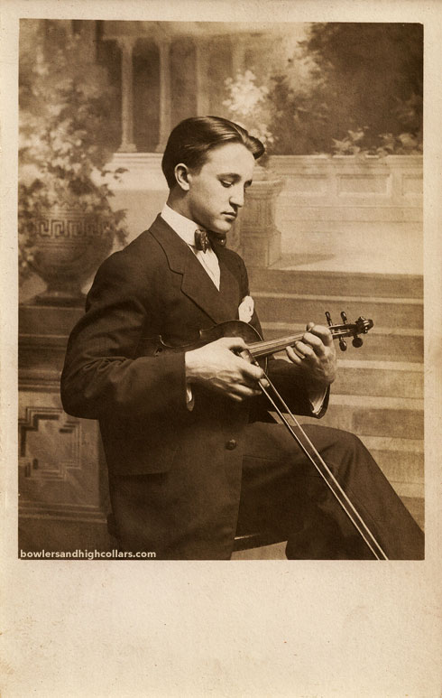 Joe Lucas playing pizzicato. RPPC. Private Collection.
