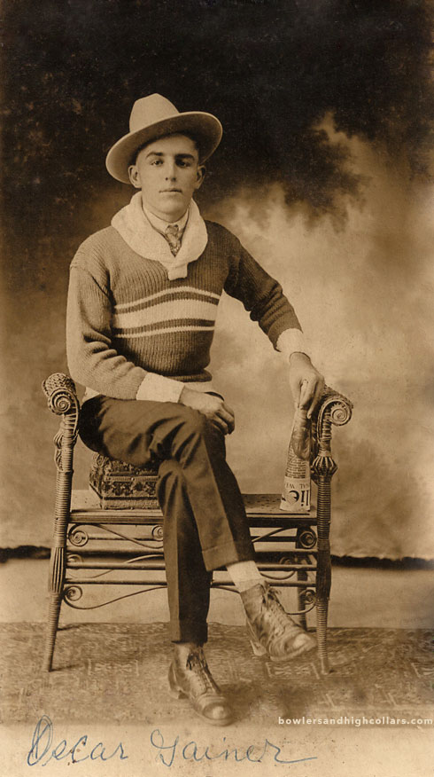 Decar Jainer with Newspaper. RPPC. Private Collection.