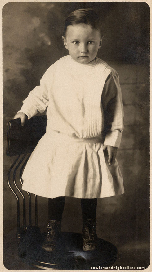 Toddler in white dress. RPPC. Private Collection.