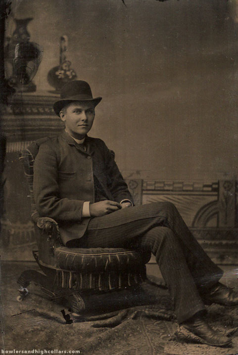Cross legged on low chair. Tintype. Private Collection.